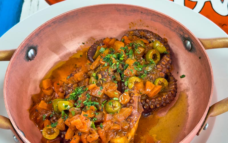 PalmBeach Tropical Restaurant | Octopus in Red | steamed octopus with fresh tomatoes, olives, and capers