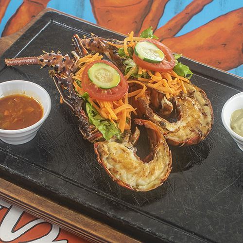 LobStar Enjoyable Seafood Restaurant | Spiny LobStar Grill (price per 100 grams) | (min. 500g), cooked on the grill and served with crioula sauce and sour salad. According to availability and sold by weight