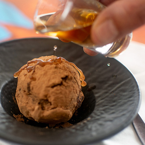 LobStar Enjoyable Seafood Restaurant | CiocoRum | dark chocolate sphere with almonds and rum, covered with cocoa powder and served with a shot of Havana 7 rum
